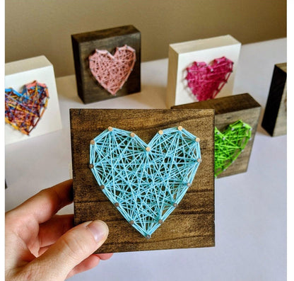 Five pieces of multicoloured heart-shaped string art as a gift for your significant other